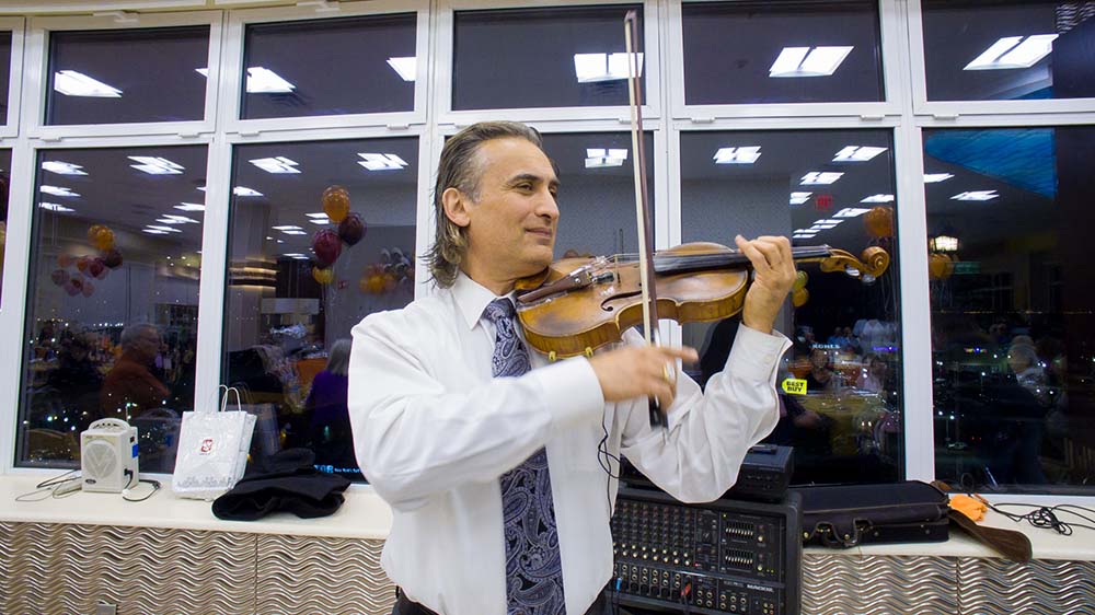 musician at holiday party rehabilitation center brooklyn nyc