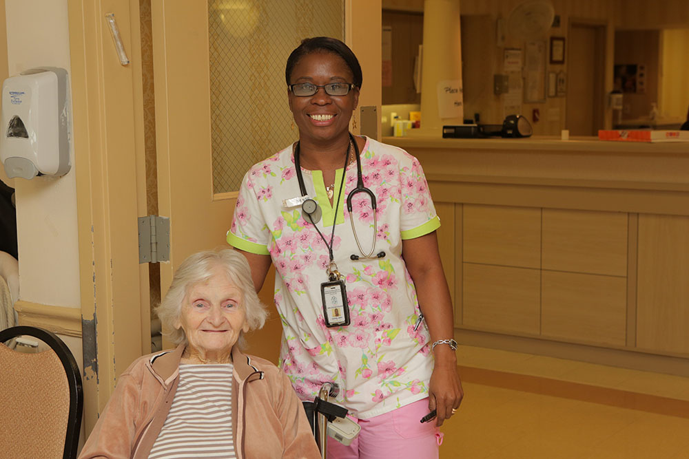 A nurse and patient with abnormal opening in the back in subacute unit at haym salomon home rehabilitation