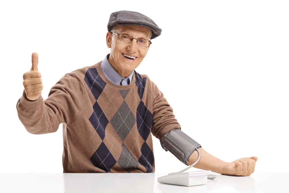 A senior man measuring changes in blood pressure