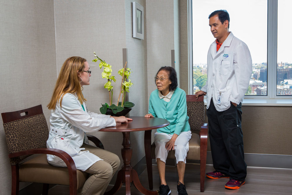 An elderly resident of Haym Salomon Home getting consultation about coronary artery disease from our nursing staff