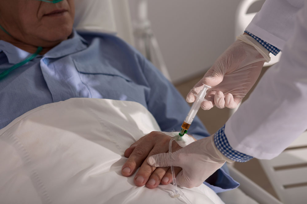 Nurse giving injection to patient with heart failure. Subacute nursing care services at Haym Salomon Home for Nursing & Rehabilitation.