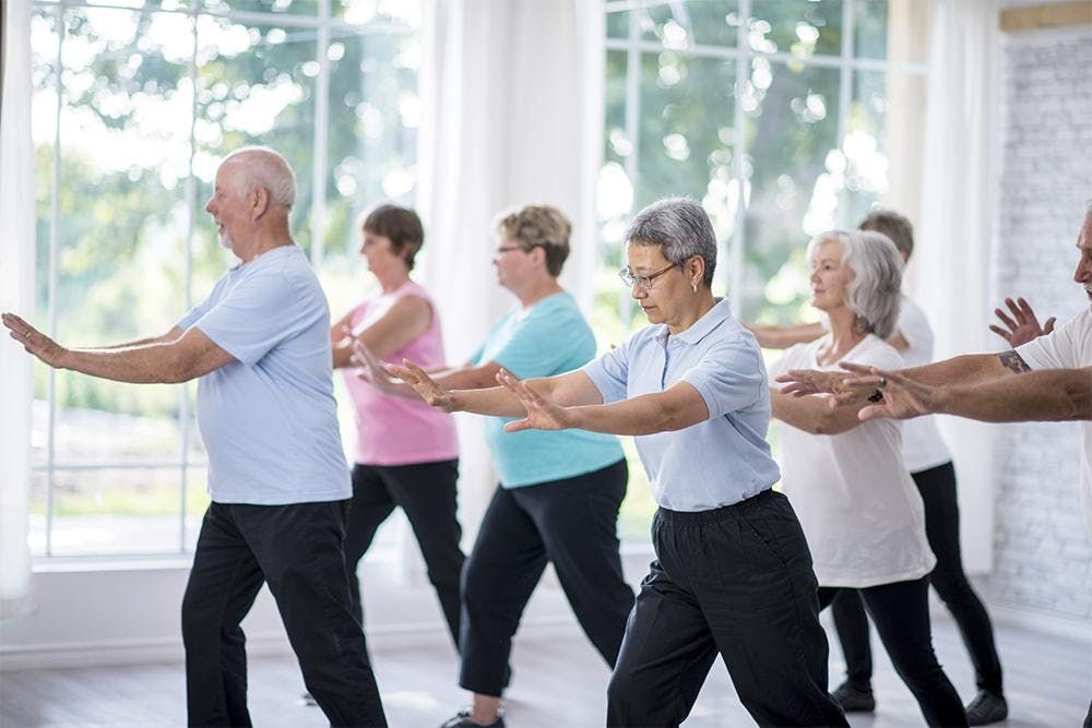 Elderly people exercising to boost their immune system