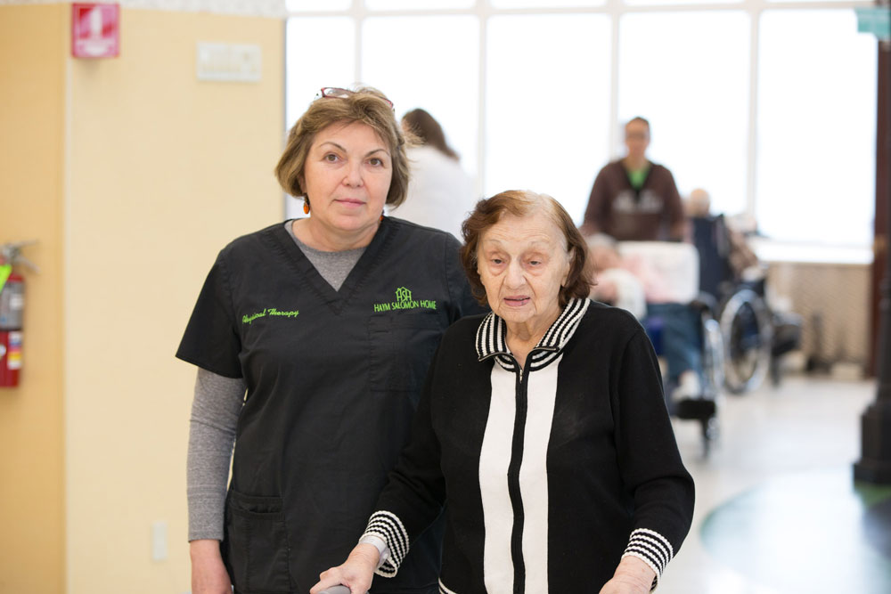 Elderly women getting stroke rehabilitation to recover from a stroke