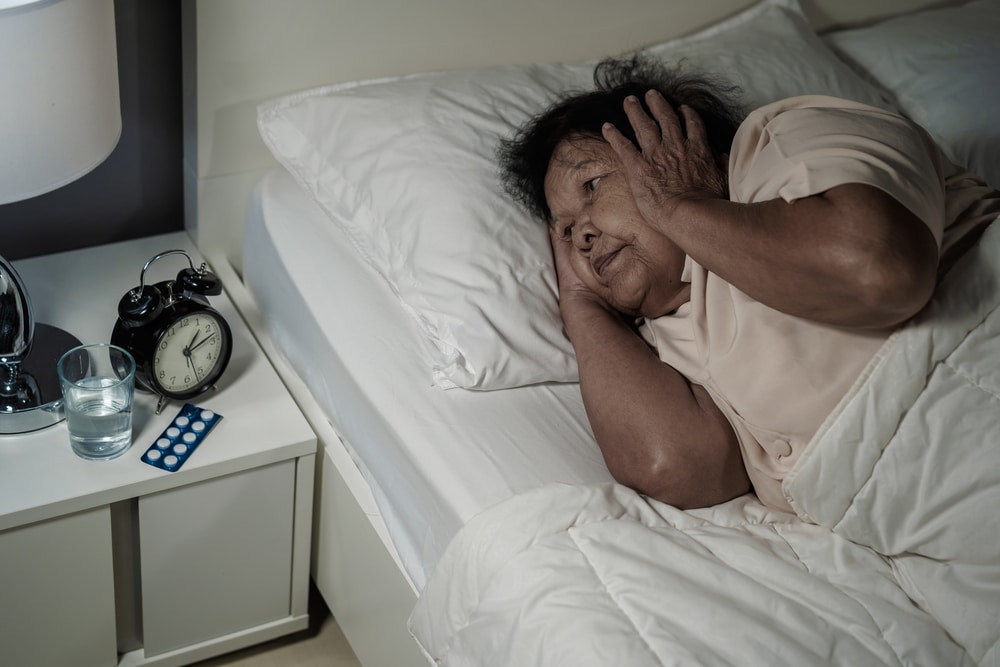 elderly old woman suffering from sleep apnea and could not sleep