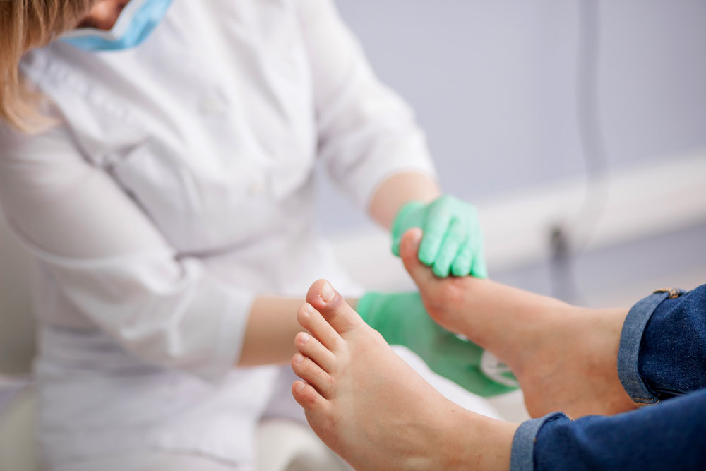 Doctor checking patients diabetic foots with bone infection and delayed wound healing.