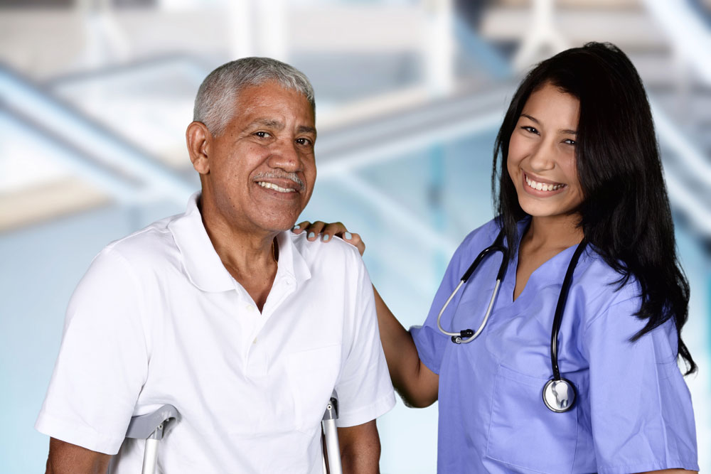 Nurse and patient smiling after a session of Pulmonary Physical Therapy