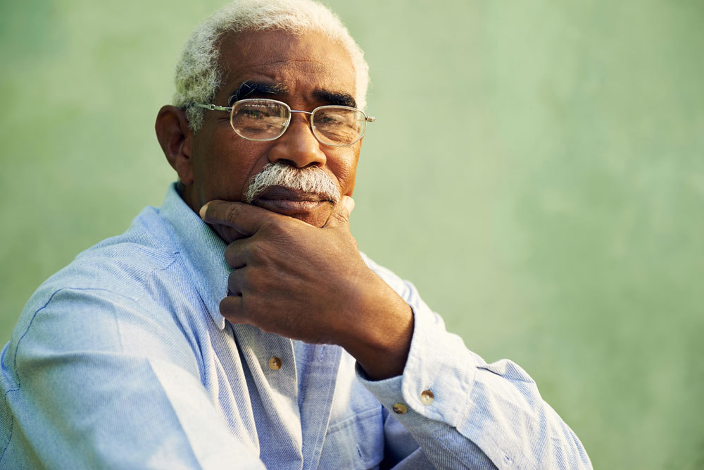 Portrait of an elderly black man getting nursing home care