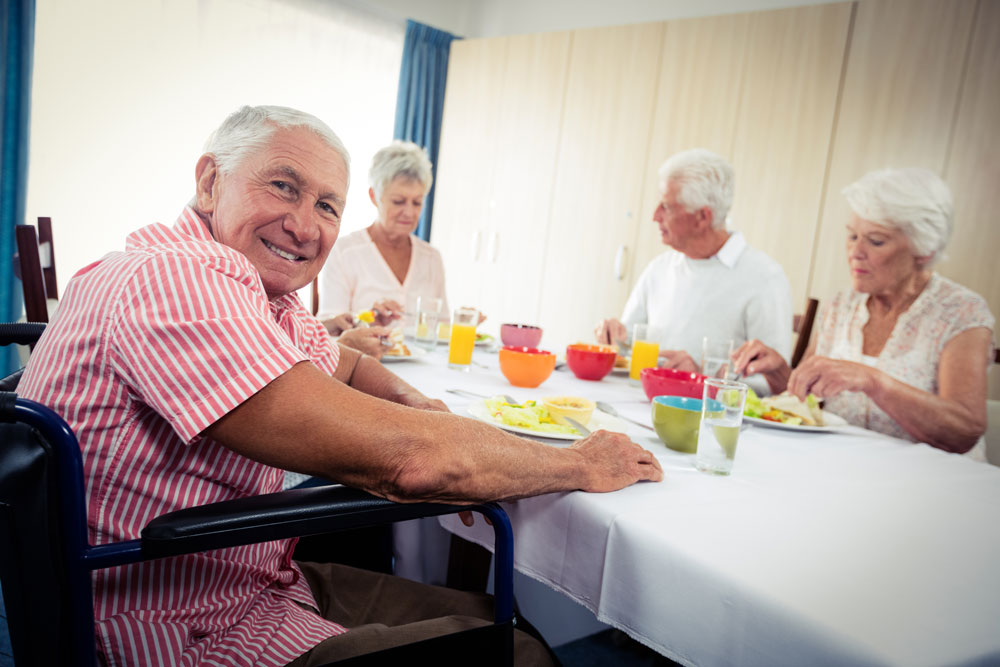 Elderly people enjoying lunch. Cognitive rehabilitation program at Haym Salomon Home.