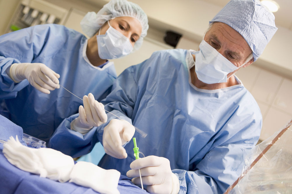 Surgeons performing surgery to remove heart blockage.